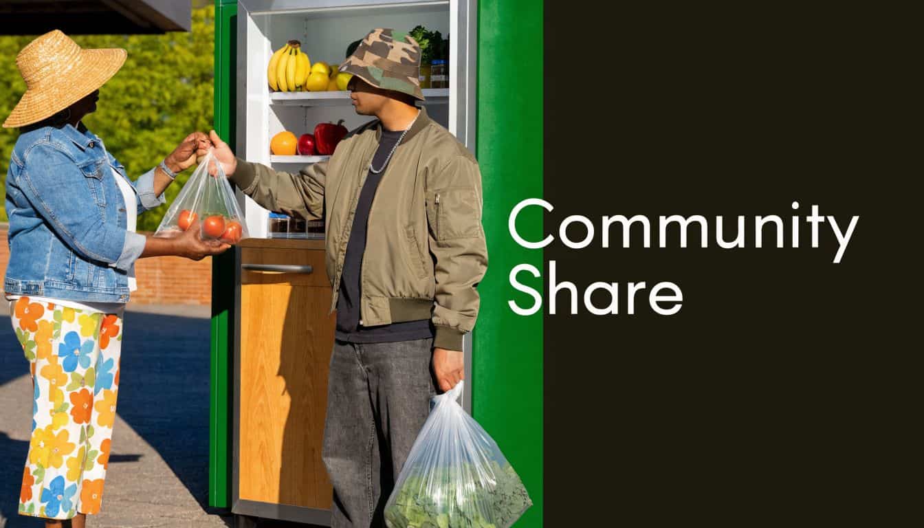 A person handing a bag of fresh tomatoes to another person in front of a community fridge.